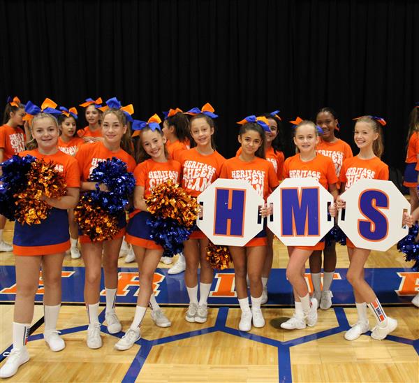 Cheerleaders with H M S letters